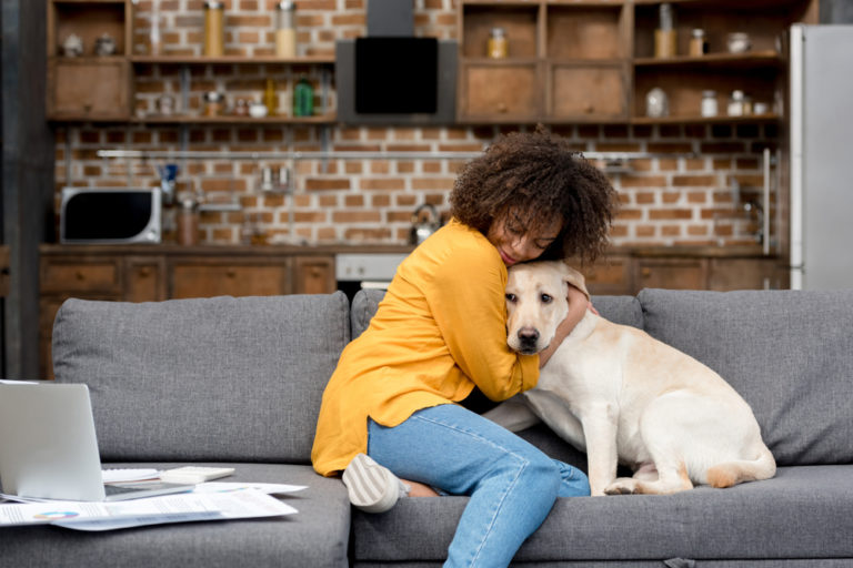girl-cuddling-her-dog